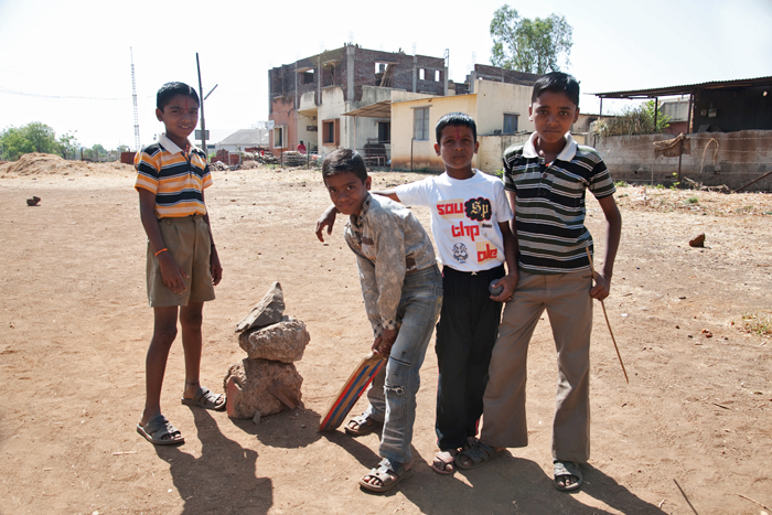 Boys playig cricket in india - photograph